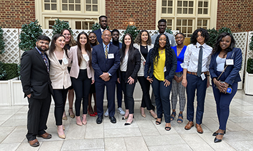 Attendees of the Minority Pre-Law Conference pose with Chief Justice of the Supreme Court of Virginia S. Bernard Goodwyn, who spoke at the event.